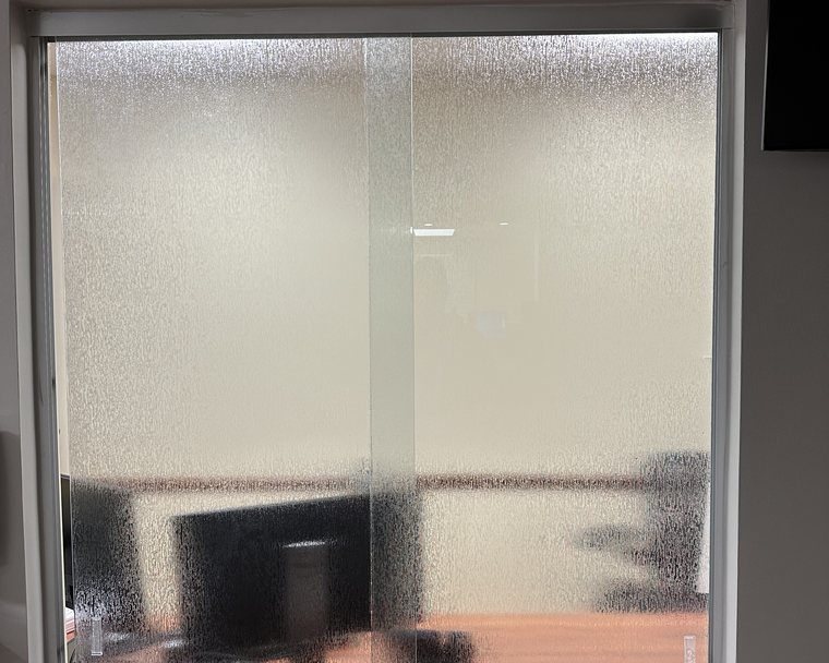 Rain-pattern decorative window film on interior glass at Emory in Atlanta