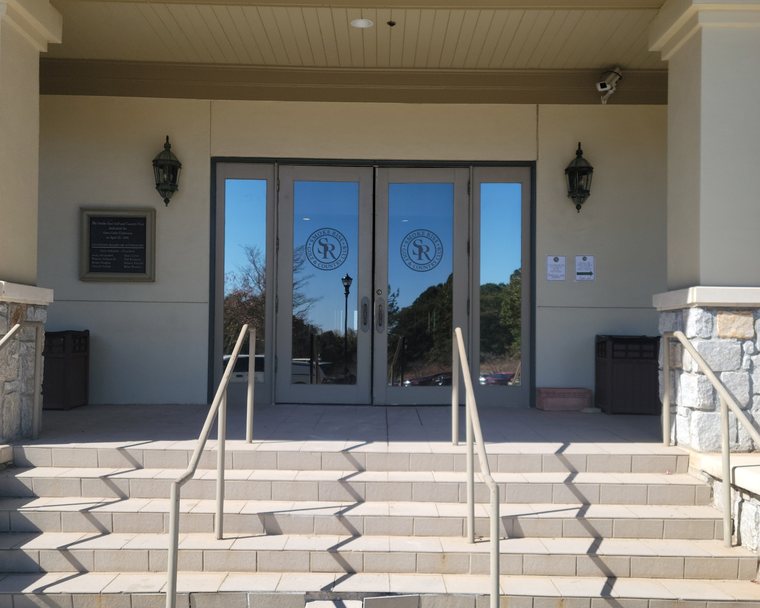 Cut vinyl logos applied to a pair of glass entrance doors