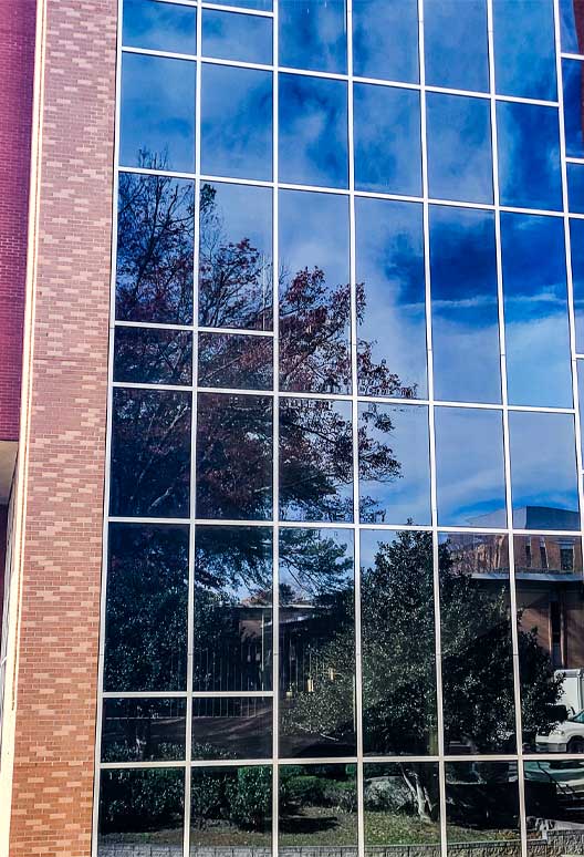 Reflective 3M window film on a commercial glass curtain wall in Metro Atlanta