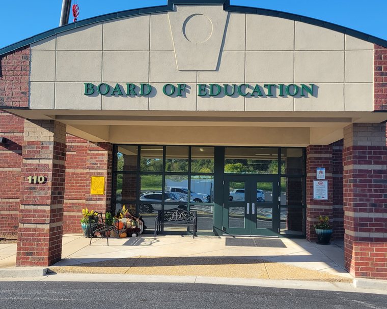 Window film on the glass entrance of a public board of education building near Atlanta