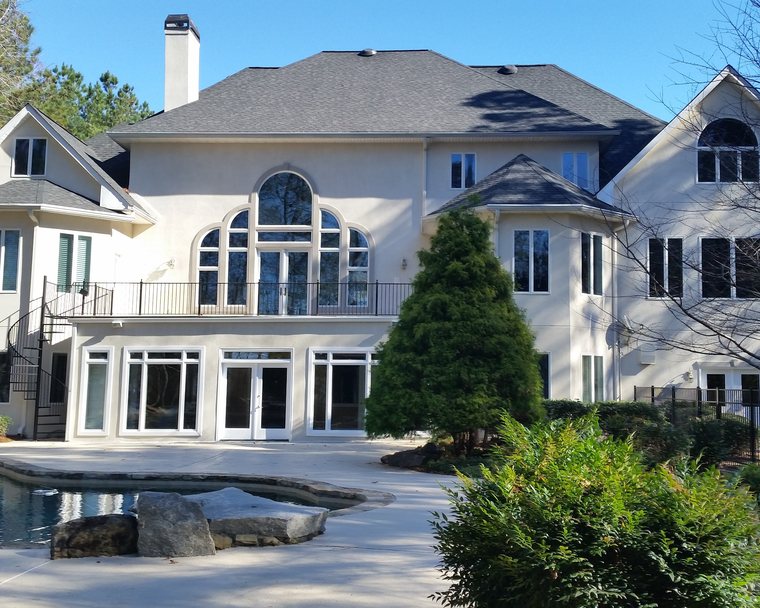 Large Peachtree City home with 3M VS60 and V38 window film on the rear elevation
